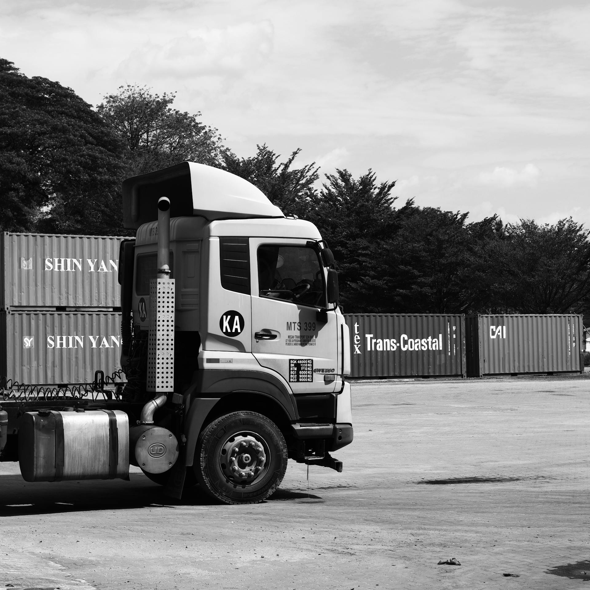 Semi-truck at a shipping yard gate
