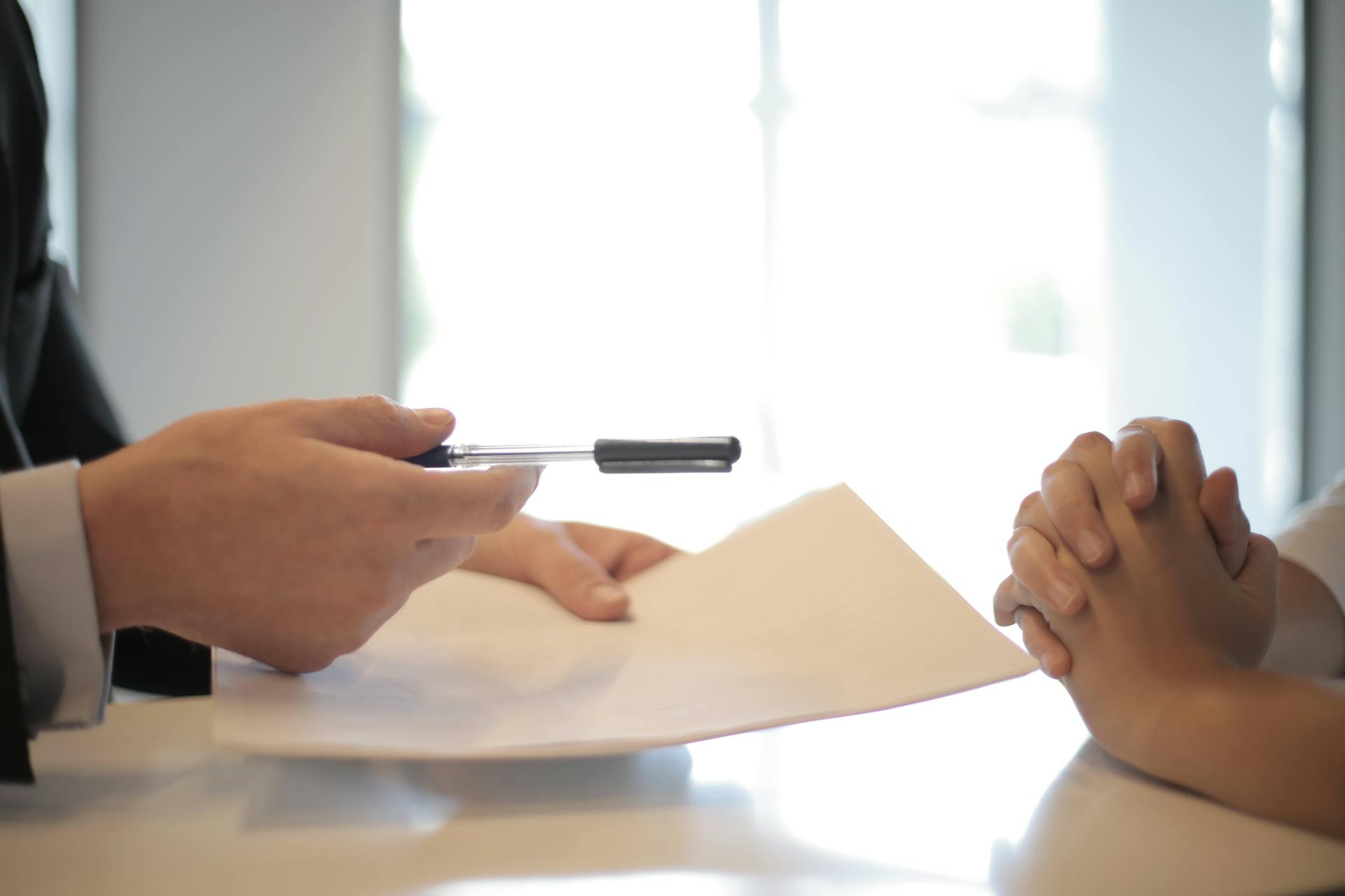 Hands signing delivery documents