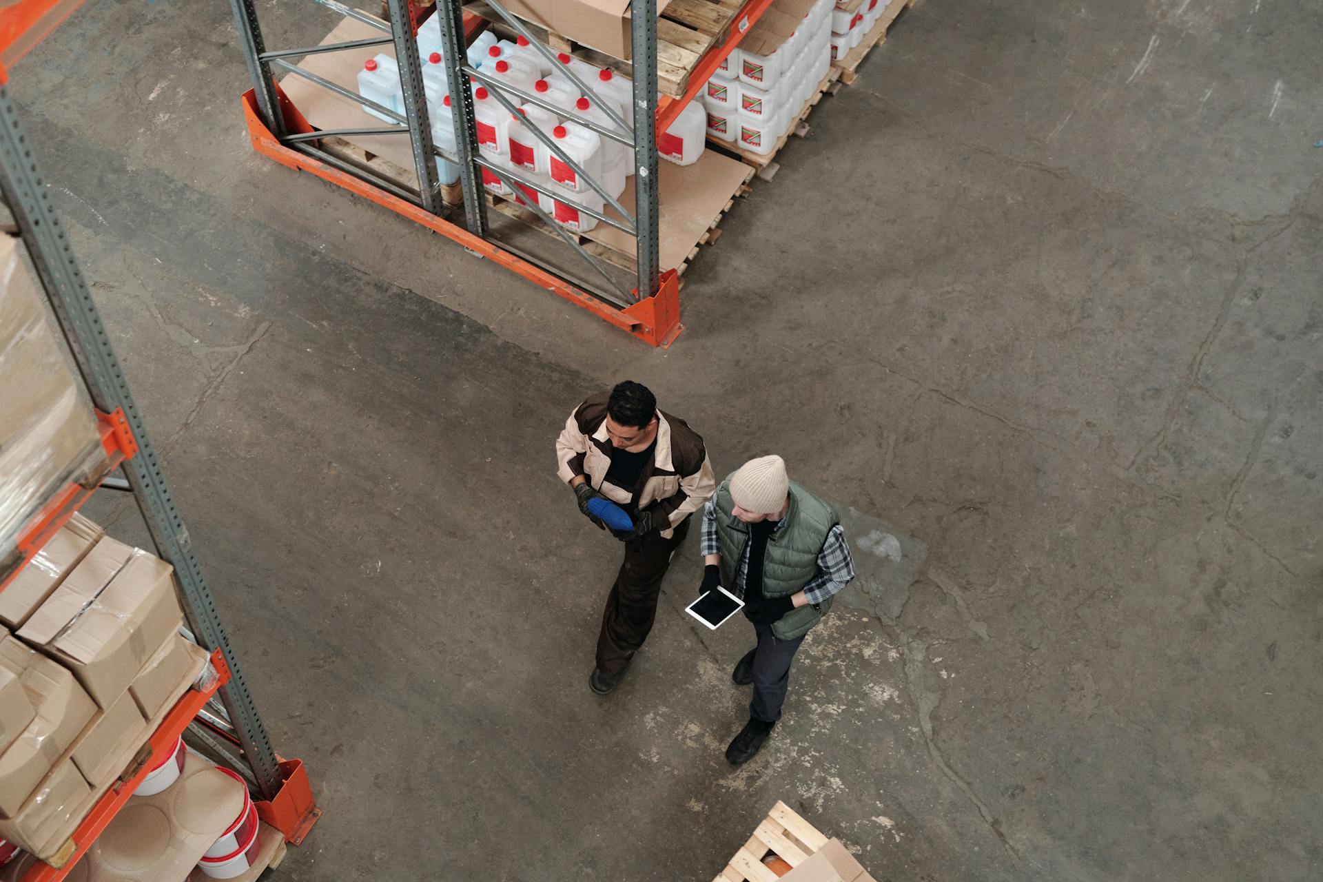 Warehouse workers using a tablet