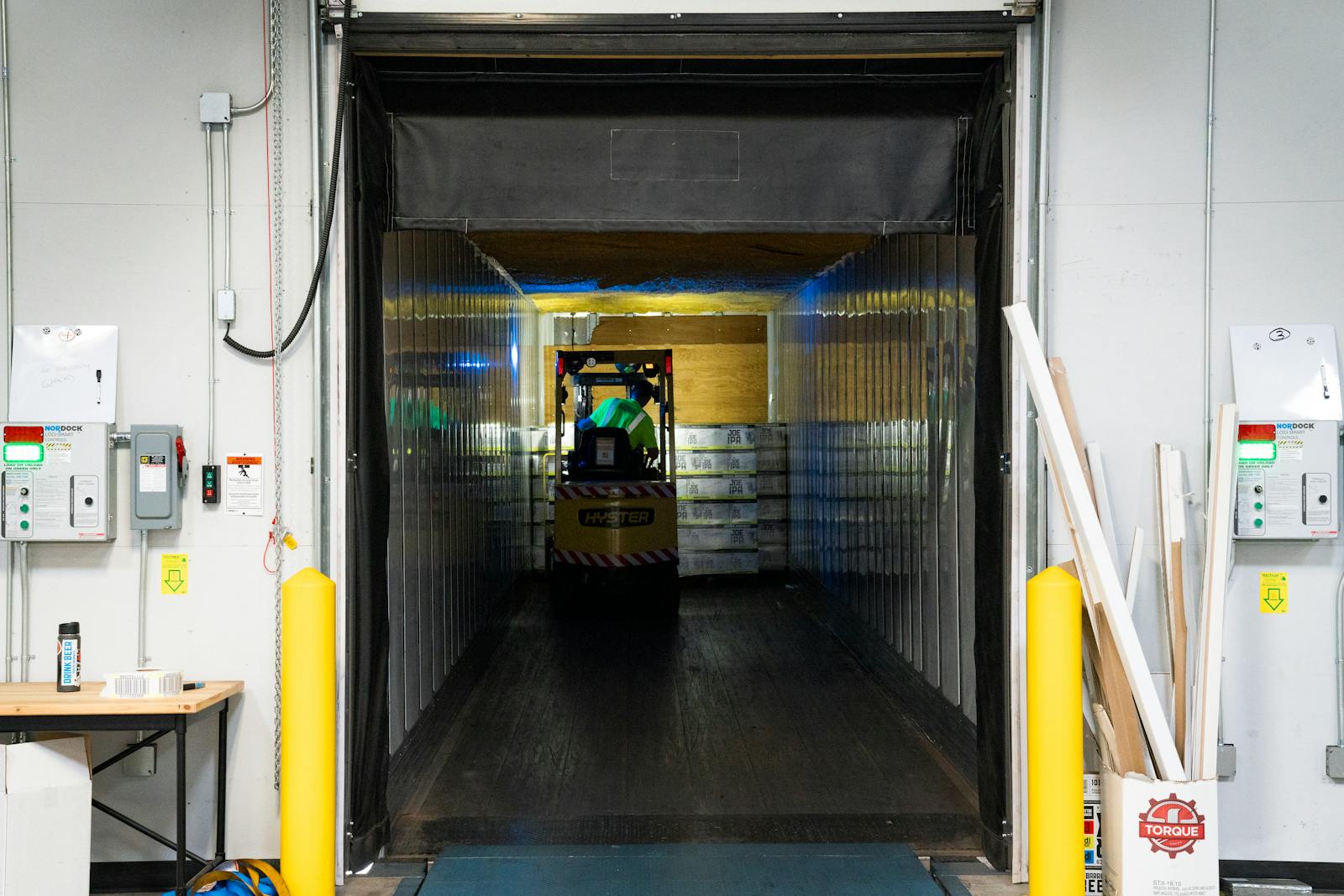 Truck at a weigh scale near a yard gate